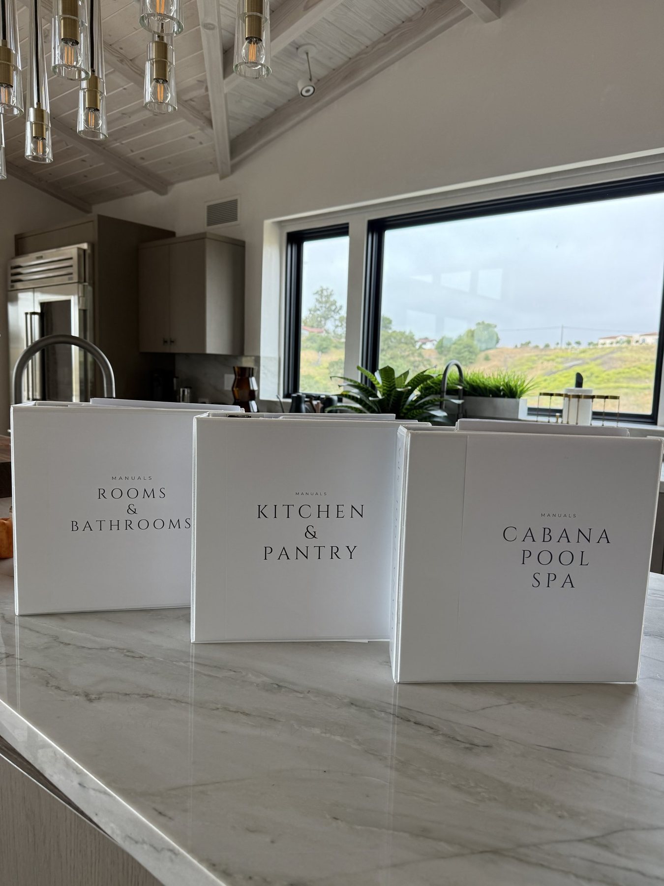 Custom house manuals on a kitchen island