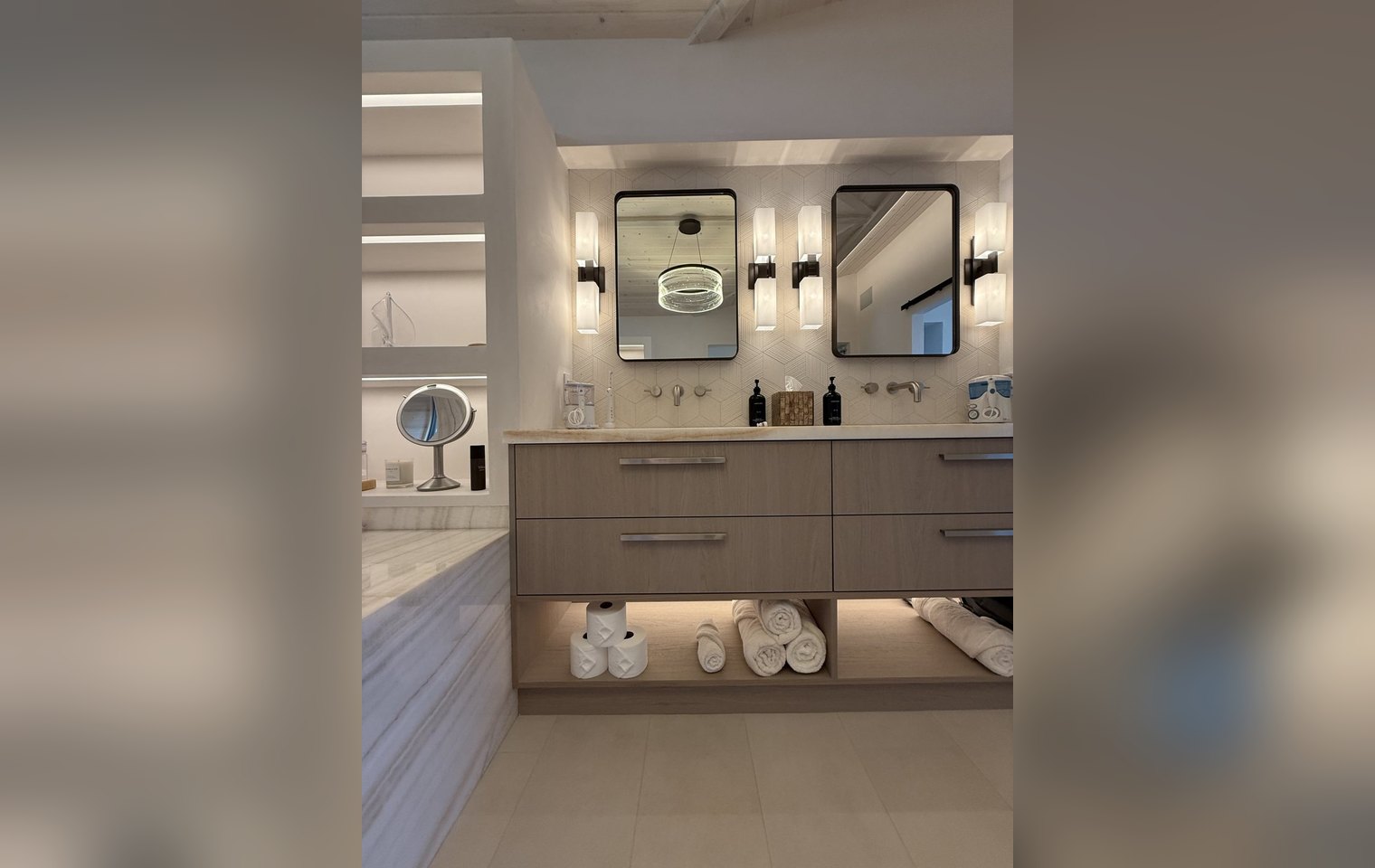 Organized primary bathroom with rolled towels