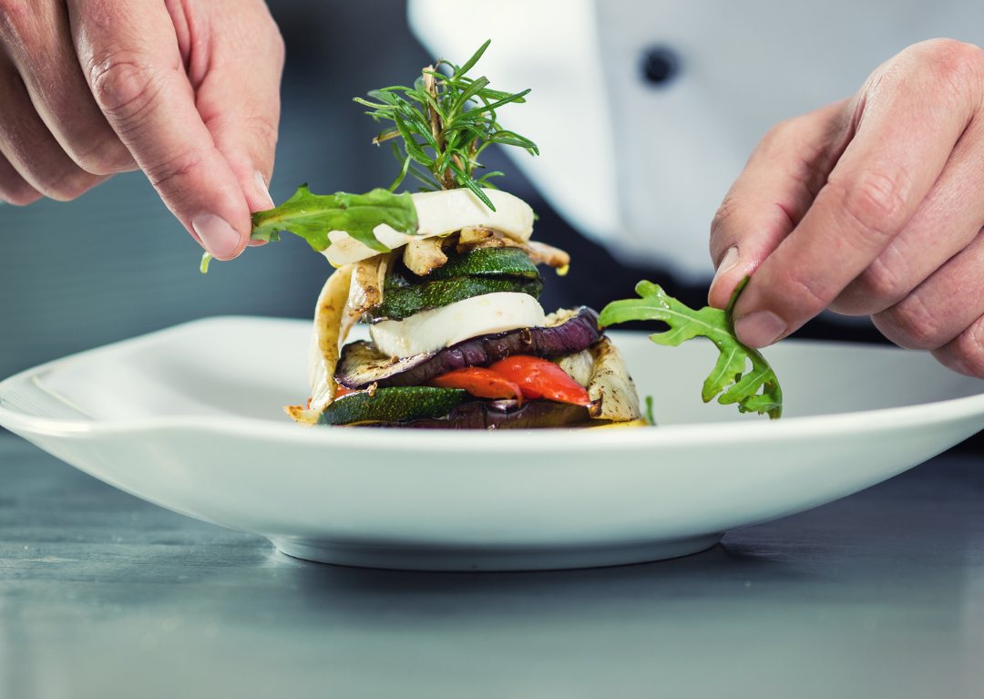 Private chef plating a dish